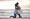 Man proposes to woman on the beach at sunset