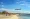 Plane landing at Aruba Airport as seen from Surfside Beach
