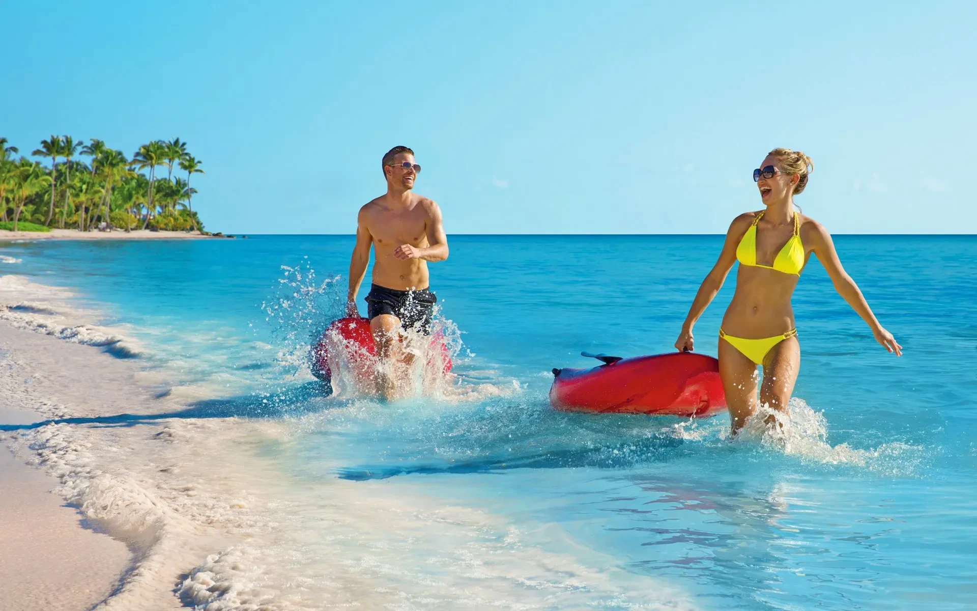 Couple enjoys beach activities in Punta Cana in 2025