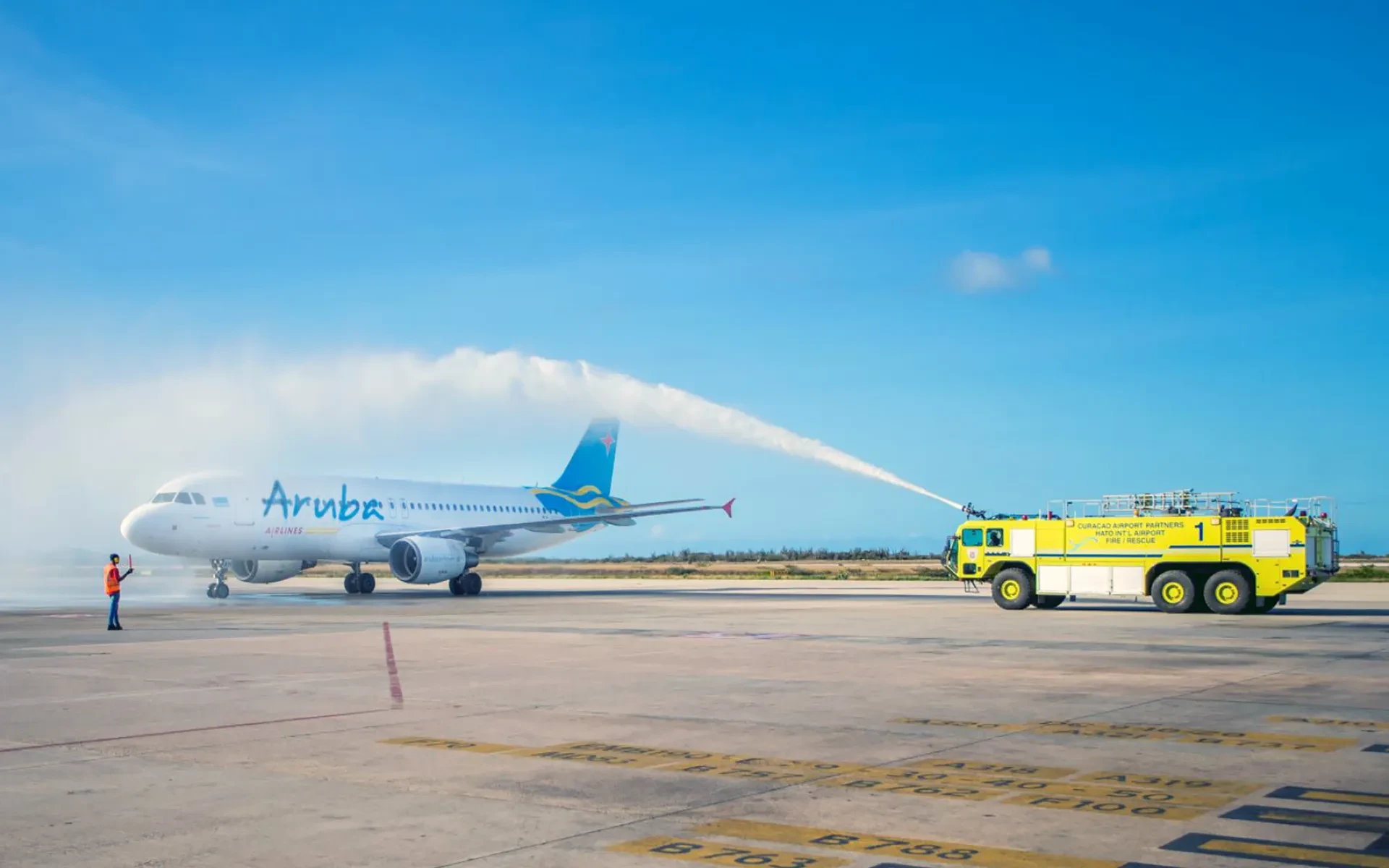 Plane at Queen Beatrix International Airport being welcomed in 2025